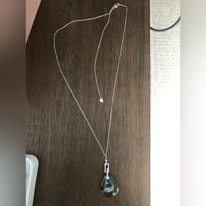 Extra long Swarovski necklace with grey tear drop crystal.